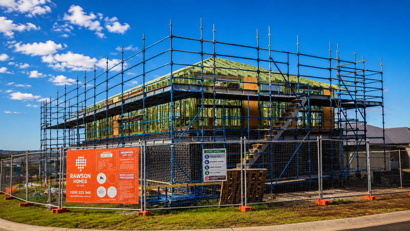 Residential scaffolding erected around a new Rawson Homes build for safe access during construction